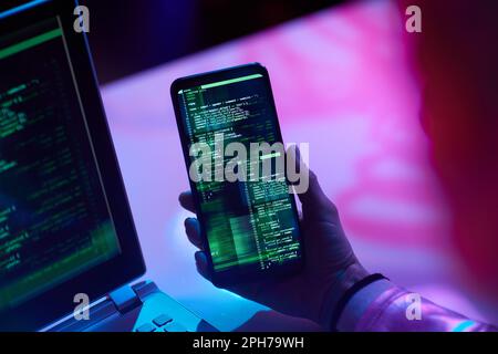 Closeup on modern female with smartphone developing video game. Stock Photo