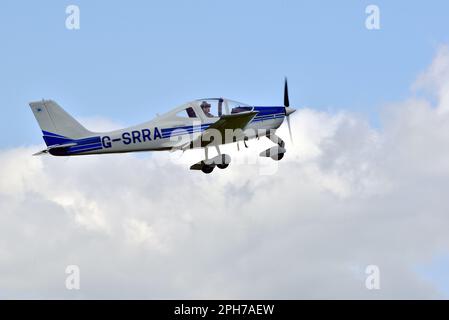 The pilot of Tecnam P2002-EA Sierra G-SRRA takes off from Compton Abbas Airfield. Stock Photo