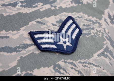 August 31, 2020. US AIR FORCE Senior Airman rank patch on digital tiger-stripe pattern Airman Battle Uniform (ABU) Stock Photo