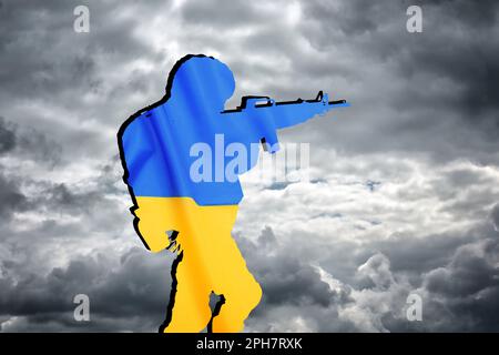 Silhouette of soldier in color of Ukrainian flag with assault rifle ...