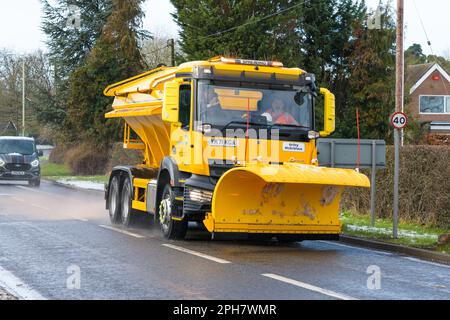 Shawbury, UK - March 10, 2023; Shropshire Highways snow plough Gritty McGritface spreading on the A53 Stock Photo