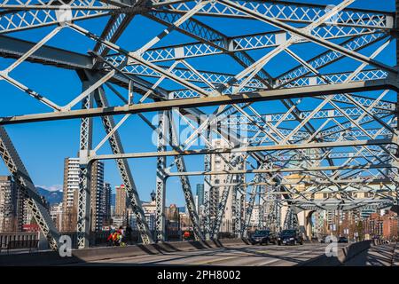 Structure of a bridge with the blue sky background. Burrard Street Bridge, Vancouver Coast, British Columbia, Canada-March 22,2023-Travel photo, stree Stock Photo