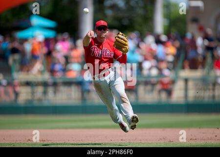 Philadelphia Phillies shortstop Scott Kingery (4) throws to first base  during a spring training baseball game against the Philadelphia Phillies on  March 26, 2023 at Ed Smith Stadium in Sarasota, Florida. (Mike