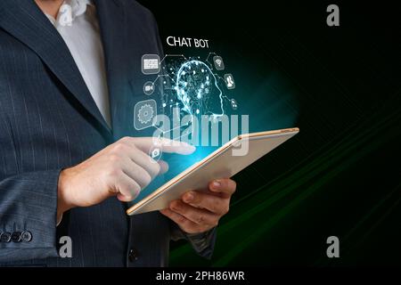 Artificial intelligence, AI chat bot concept. Businessman hands using tablet. ai chatbot infographic Stock Photo