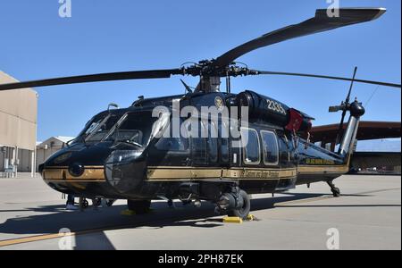 A UH-60 Blackhawk helicopter parked on the runway at Davis-Monthan Air Force Base. This UH-60 is operated by the U.S. Customs and Border Patrol (CBP). Stock Photo