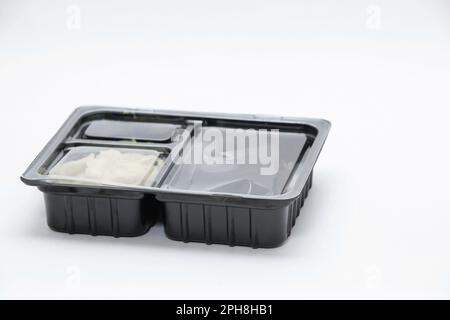 plastic food container with sushi from restaurant on isolated background, takeaway food order Stock Photo