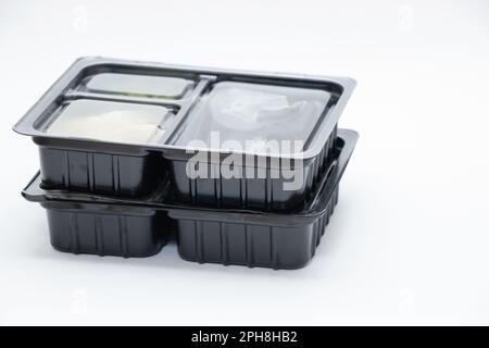 plastic food container with sushi from restaurant on isolated background, takeaway food order Stock Photo