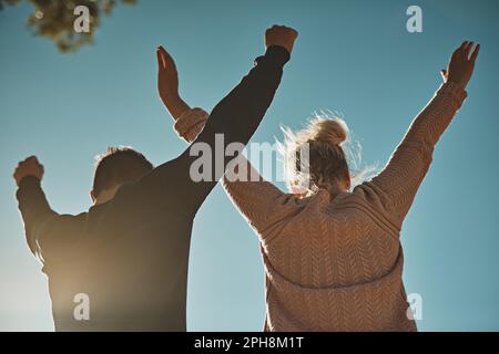 We made it to the top. a couple celebrating after reaching the summit. Stock Photo
