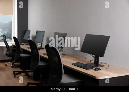 Many modern computers in open space office Stock Photo