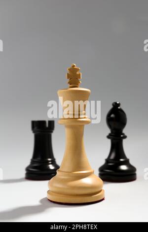 Chess pieces on a chessboard - Focus on the King Stock Photo - Alamy