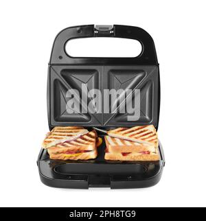 Modern grill maker with sandwiches on white background Stock Photo