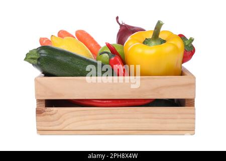 Fresh ripe vegetables and fruits in wooden crate on white background Stock Photo