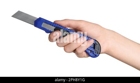 Woman holding utility knife on white background, closeup Stock Photo