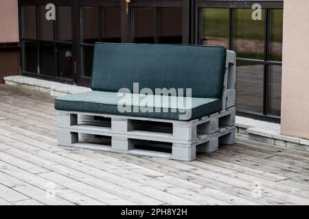 Soft bench diy industrial recycled made from old wooden storage pallets Stock Photo