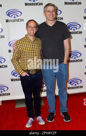 Elliot Kalan, Eric Koenig arrive at the press room for'Housebroken' during Day 2 of the 2023 WonderCon convention at the Anaheim Convention Center on