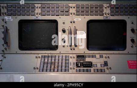 A high-resolution close-up of a classic mission control console, featuring various dials, buttons, and displays Stock Photo