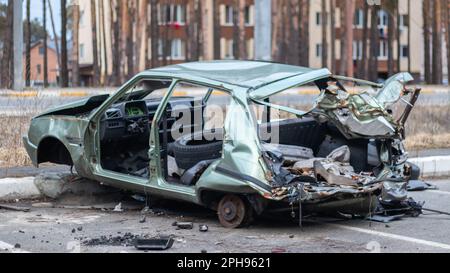 Broken crumpled car after a severe accident with a skewed body, after a powerful impact on the side of the road. Traffic accident on the street, damag Stock Photo