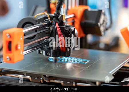 3d printer printing objects closeup. Modern technical 3D printing. Stock Photo
