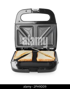 Modern sandwich maker with bread slices on white background Stock Photo
