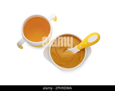 Healthy baby food in bowl and bottle with drink on white background, top view Stock Photo