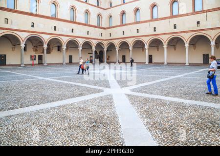 MILAN, ITALY - MAY 10, 2018: This is a view of the courtyard towards the walls and arcades of the medieval fortress of Rocchetta inside the Castle of Stock Photo