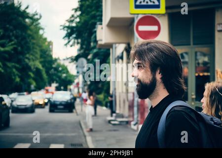 Bearded man on a city street Stock Photo