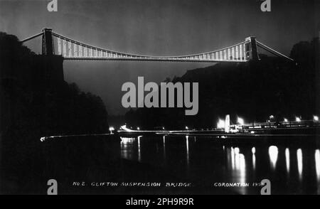 Bristol, England. 1953. Vintage postcard entitled “Clifton Suspension Bridge – Coronation 1953” depicting the bridge at night, especially illuminated to celebrate the coronation of Queen Elizabeth II in June 1953. Stock Photo