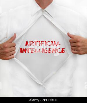 Man opens his shirt to reveal AI - Artificial Intelligence - written on it Stock Photo