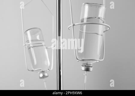 IV infusion set on light grey background Stock Photo