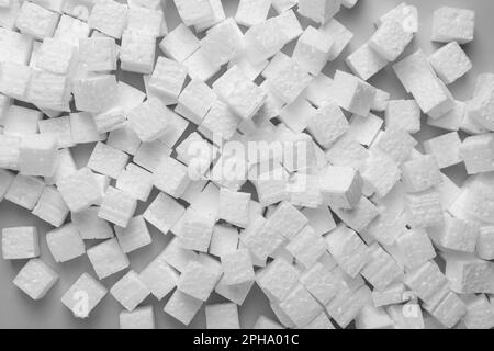 Many styrofoam cubes on grey background, flat lay Stock Photo