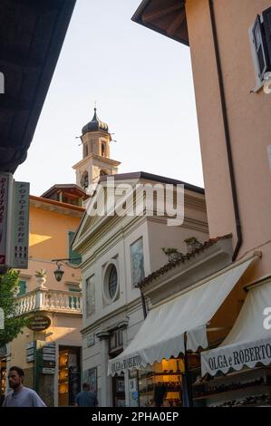 Pretty streets covered in flowers of old Limone Sul Garde, a popular town on the shore of Lake Garda, Italy Stock Photo