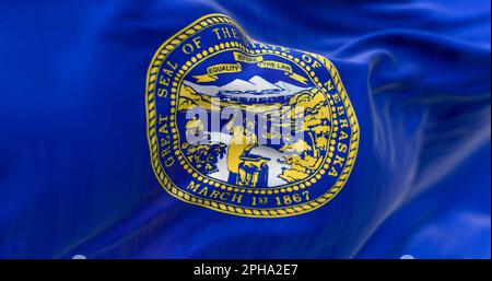 Close-up of the Nebraska state flag fluttering. The flag of is blue with the state seal in the center. 3D illustration render. Close-up. Textured text Stock Photo