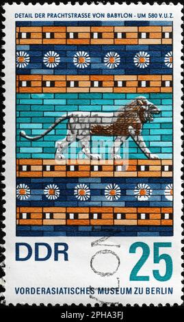 Detail from the processional way of Babylon in Pergamon Museum of Berlin on stamp Stock Photo