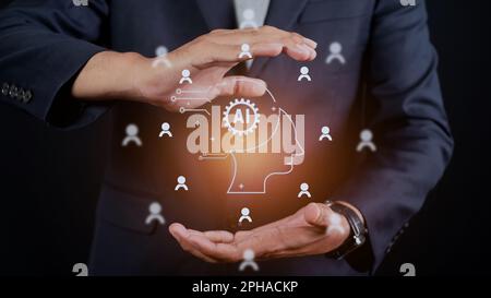 Concept of artificial intelligence or AI in business. Man holding smart robot technology icon. Futuristic technological transformation Stock Photo