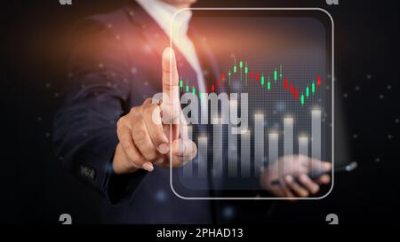 Investment stock market concept, Stock investor businessman touching virtual screen chart Stock Photo