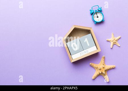 June 1th. Image of june 1 wooden calendar on colored background. Summer day. Empty space for text. Stock Photo