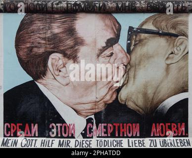 My God, Help Me to Survive This Deadly Love (Fraternal Kiss) graffiti painting by Dmitri Vrubel on Berlin wall, Germany