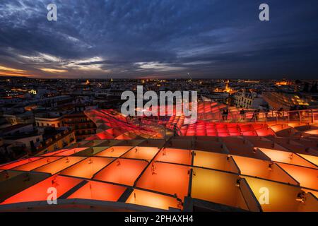 Seville, Spain - March 3, 2023: Metropol Parasol at night. It is a wooden structure designed by Juergen Mayer, with dimensions 150 by 70 meters and 26 Stock Photo