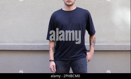 black t-shirt on young male on the street. fashion mockup Stock Photo
