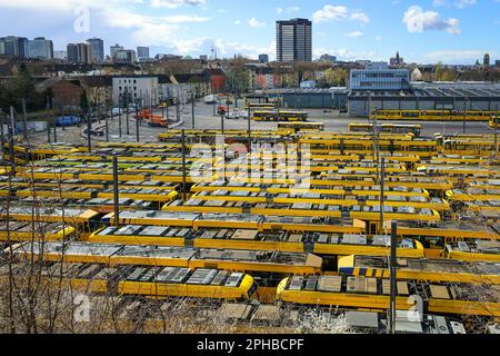 Essen, North Rhine-Westphalia, Germany - Trams parked in the Ruhrbahn depot, Verdi and EVG warning strike, Essen city hall in the back. Stock Photo