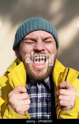 Candid positive emotions of adult bearded man. Stock Photo