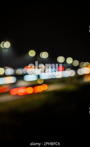 Defocused street lighting and car lights at night Stock Photo