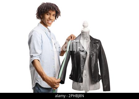 Young african american man measuring a jacket and smiling isolated on white background Stock Photo