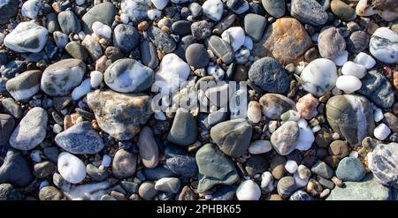 Rocks Water for Background. Pebble Stones Close-up. Vacation Holiday Recreation on Beach Concept. High Quality Photo. Stock Photo