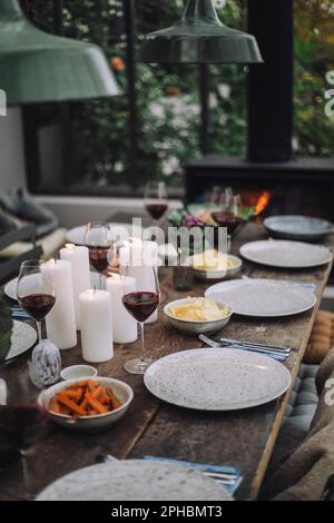 Dining table with wineglasses and plates Stock Photo