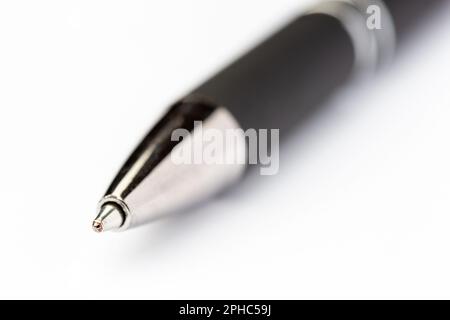 the tip of a ball point pen on white background Stock Photo