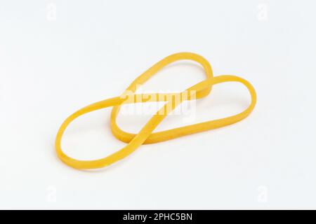 Yellow elastic band on white background Stock Photo