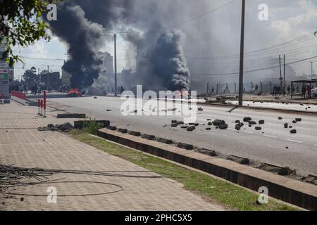 Nairobi, Kenya. 27th Mar, 2023. Car tires burn during a demonstration called by Azimio party leader Raila Odinga over the cost of living and president William Ruto's administration. Credit: SOPA Images Limited/Alamy Live News Stock Photo