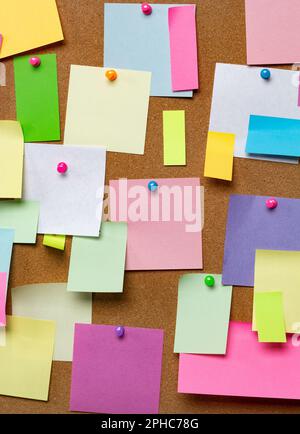 Post blank stickers on cork bulletin board. Concept of business notes. Stock Photo