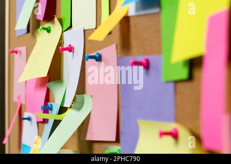 Post blank stickers on cork bulletin board. Concept of business notes. Stock Photo
